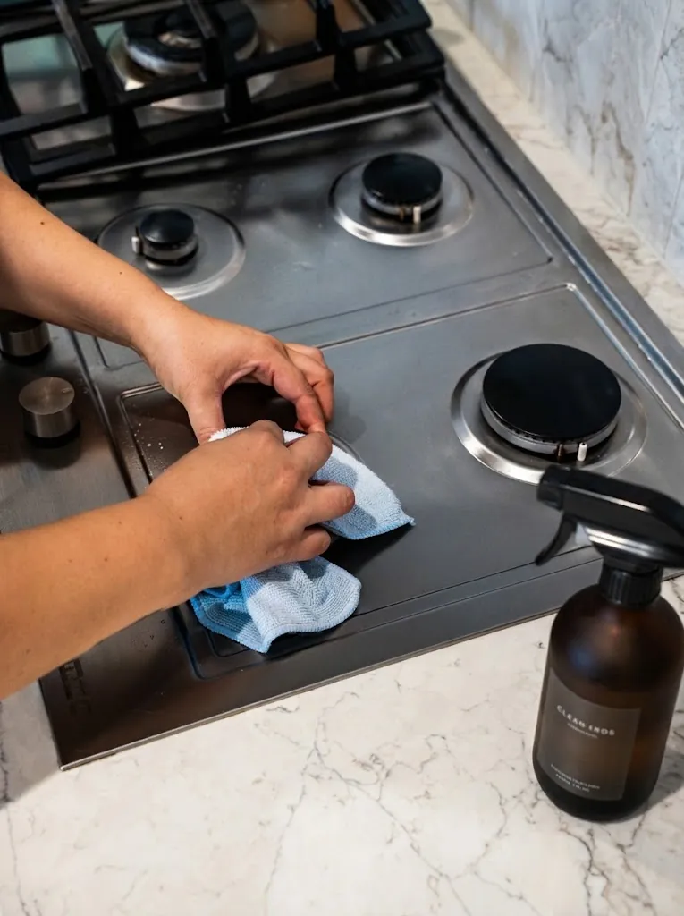 A microfibre cloth working around a gas burner
